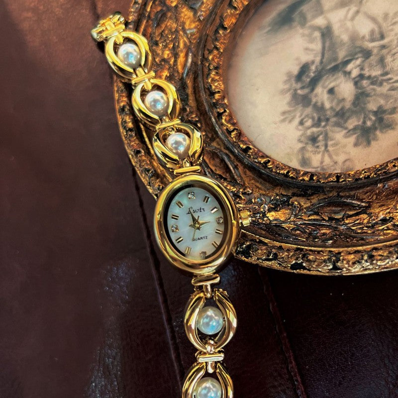 Neue mittelalterliche Luxusimitat-Perlenuhr Temperament Armband Damenuhr