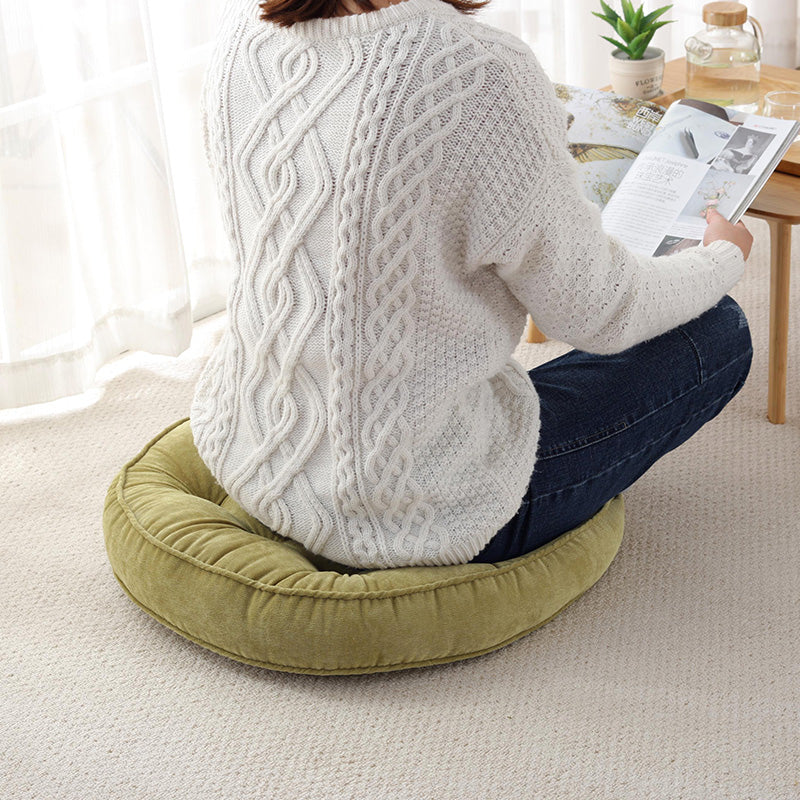 Padded cushion made of corduroy in a single colour