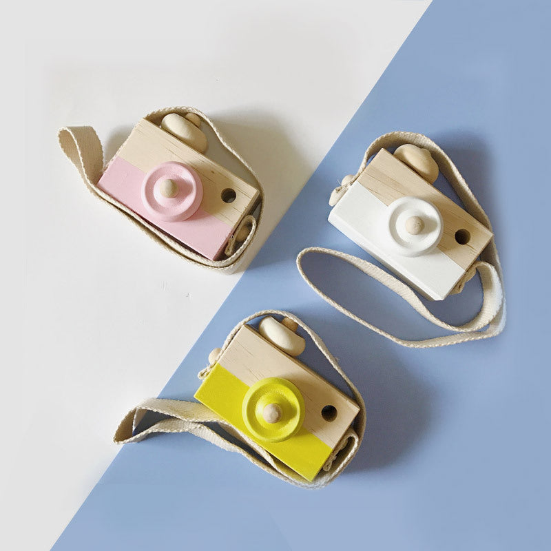 Cute wooden toy camera for babies and kids.